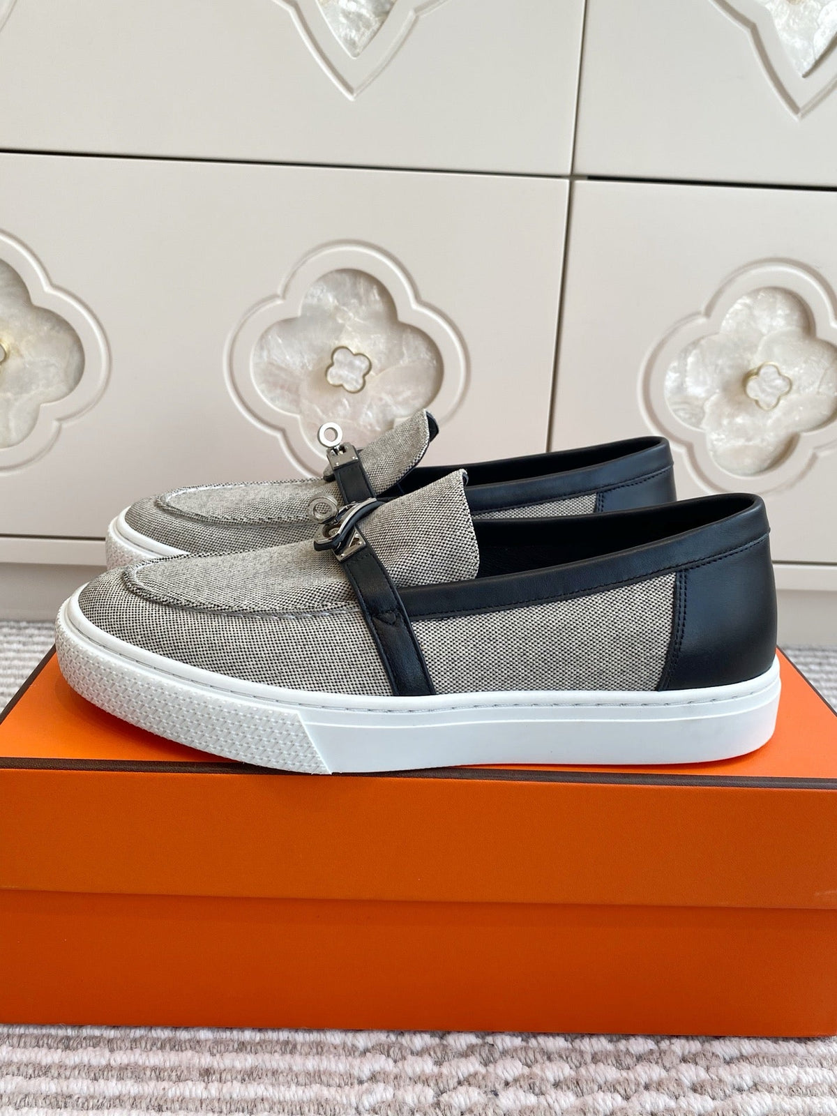 HERMES 25S SLIP-ON IN GREY CANVAS AND BLACK LAMBSKIN WITH SILVER HARDWARE